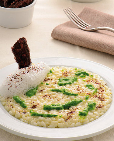 Riso integrale all’acqua di parmigiano, pesto di alghe e latte di mandorle 