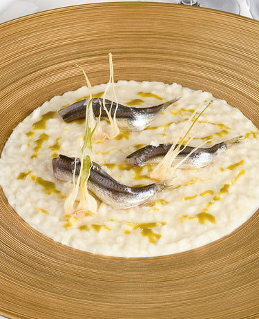 foto ricetta Riso mantecato ai pistacchi, alici e cipollotto croccante 